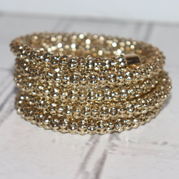 Beautiful gold bangle coil bracelet *fits most wrists sizes* - Picture 1 of 4